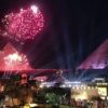Fireworks lighting up the night sky above the Pyramids of Giza during a New Year's celebration.